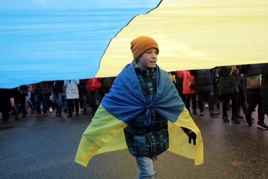 Українці протестують проти російської агресії на марші в Києві 12 лютого 2022 року. Фото: Геннадій Мінченко/Укрінформ/Future Publishing через Getty